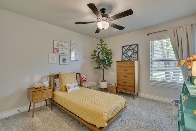 bedroom with baseboards, light colored carpet, and ceiling fan