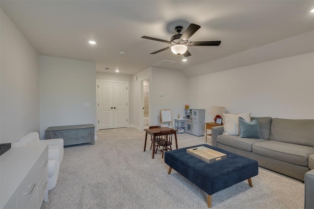 living room with a ceiling fan, light colored carpet, recessed lighting, and visible vents