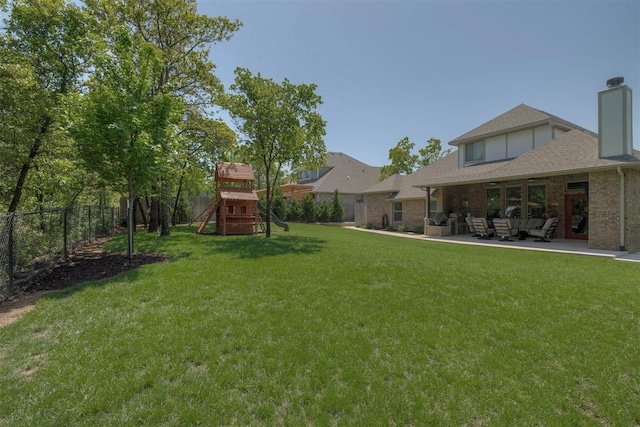 view of yard featuring a fenced backyard, an outdoor hangout area, a playground, and a patio area