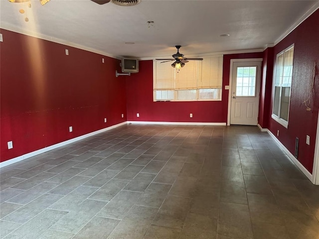 tiled spare room featuring baseboards, ornamental molding, and ceiling fan