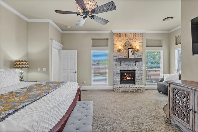 carpeted bedroom featuring crown molding, multiple windows, and a brick fireplace