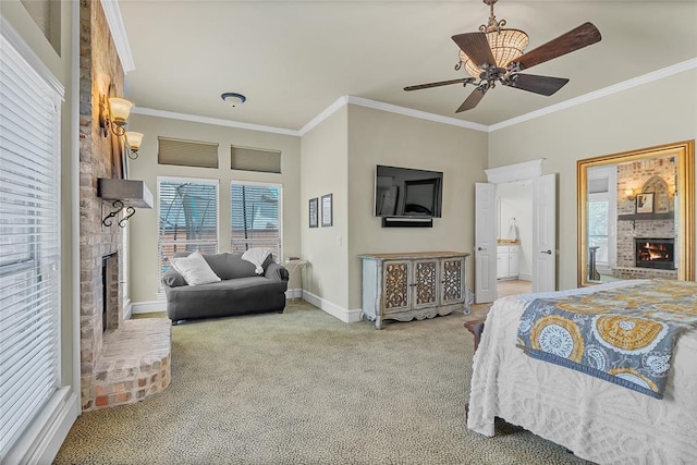 carpeted bedroom with baseboards, ornamental molding, a brick fireplace, and ceiling fan