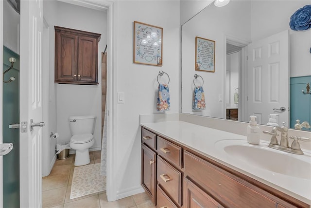 full bath featuring vanity, baseboards, tile patterned floors, and toilet