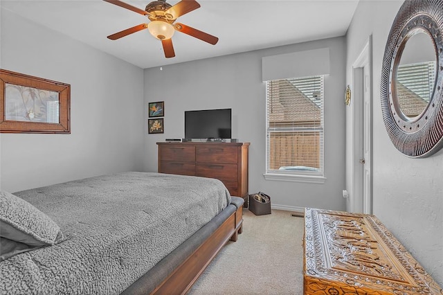 carpeted bedroom featuring a ceiling fan