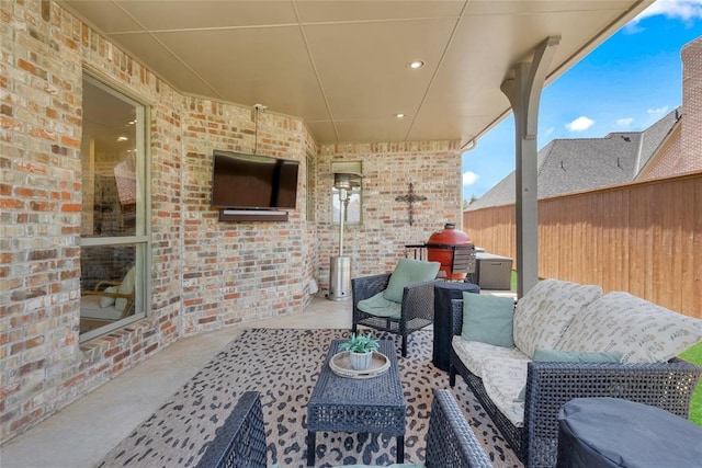 view of patio / terrace with fence and an outdoor hangout area