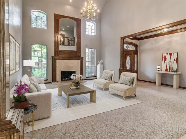 3601 Rena Dawn Ln, Edmond, OK 73013 - carpeted living room with a towering ceiling, a notable chandelier, and a wealth of natural light