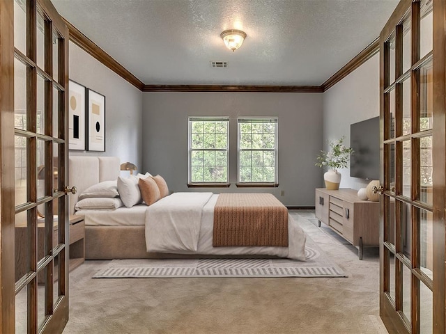 3601 Rena Dawn Ln, Edmond, OK 73013 - carpeted bedroom with a textured ceiling, visible vents, ornamental molding, and french doors