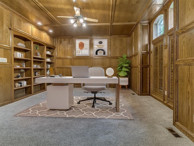3601 Rena Dawn Ln, Edmond, OK 73013 - carpeted office space featuring a ceiling fan, wood walls, wooden ceiling, and visible vents