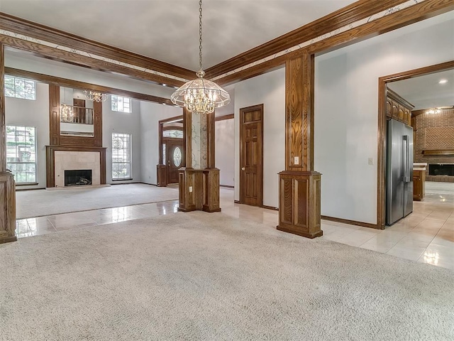 3601 Rena Dawn Ln, Edmond, OK 73013 - unfurnished living room featuring a chandelier, light carpet, light tile patterned floors, and a fireplace