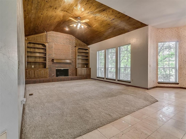3601 Rena Dawn Ln, Edmond, OK 73013 - unfurnished living room with a ceiling fan, vaulted ceiling, built in features, and plenty of natural light