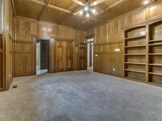 3601 Rena Dawn Ln, Edmond, OK 73013 - unfurnished bedroom with wood ceiling, visible vents, crown molding, carpet floors, and wooden walls