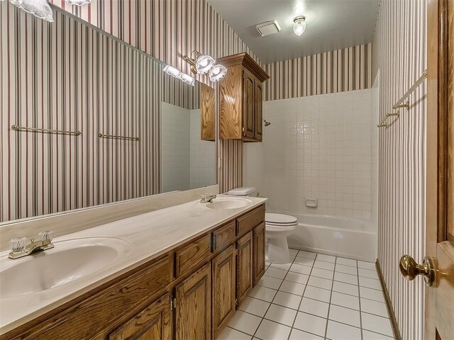 3601 Rena Dawn Ln, Edmond, OK 73013 - bathroom featuring a sink, tile patterned floors, toilet, and wallpapered walls