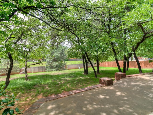3601 Rena Dawn Ln, Edmond, OK 73013 - exterior space featuring a fenced backyard, a lawn, and a patio area
