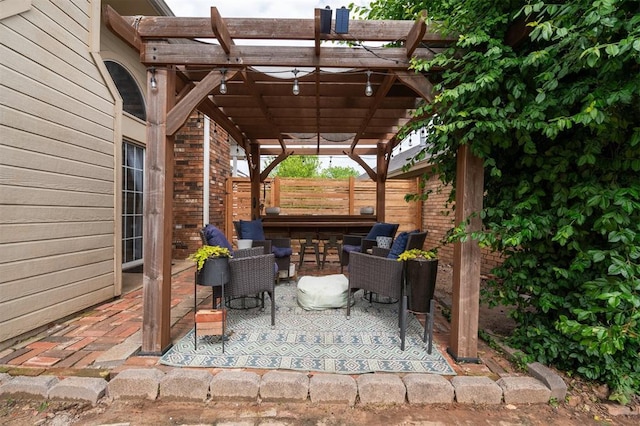 view of patio featuring a pergola and fence