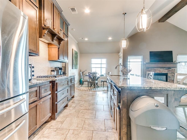 kitchen with freestanding refrigerator, lofted ceiling with beams, decorative backsplash, and light stone counters