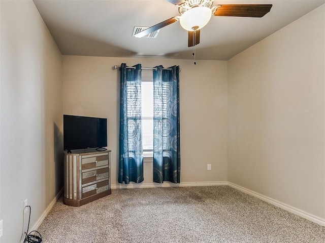 unfurnished bedroom featuring carpet flooring, a ceiling fan, and baseboards
