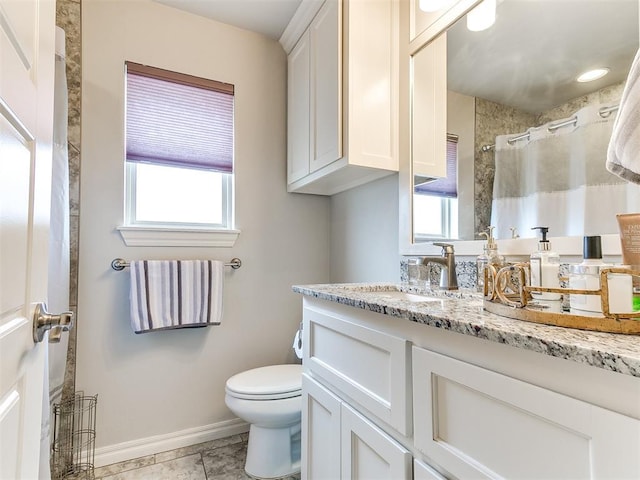 full bathroom with tile patterned flooring, vanity, curtained shower, toilet, and baseboards
