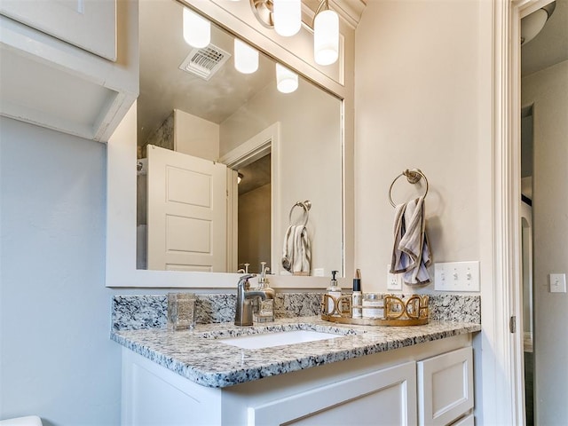 bathroom featuring visible vents and vanity