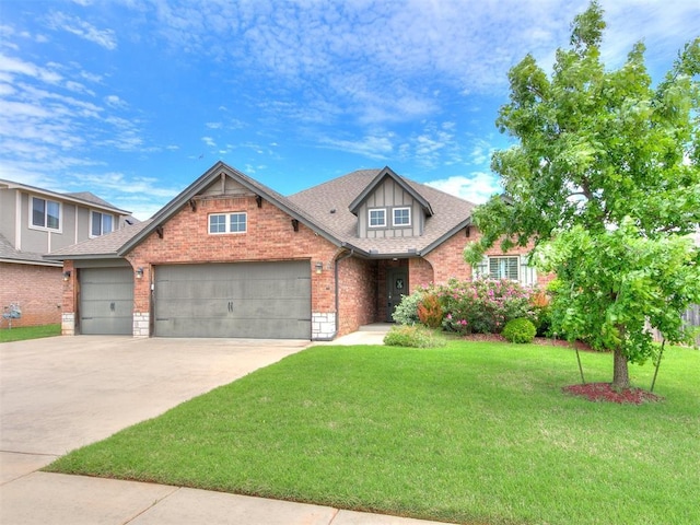 craftsman-style home with a garage, a front yard, roof with shingles, brick siding, and driveway