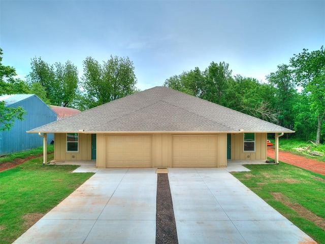 1823 E Rutgers Ave, Guthrie, OK 73044 - single story home with a shingled roof, an attached garage, a front lawn, board and batten siding, and driveway