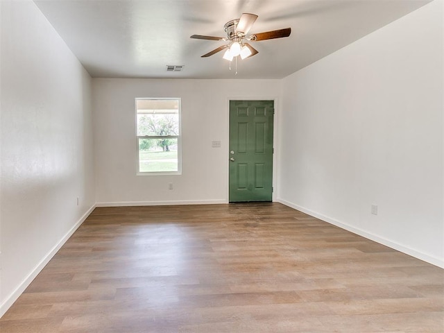 1823 E Rutgers Ave, Guthrie, OK 73044 - empty room featuring baseboards, ceiling fan, and wood finished floors