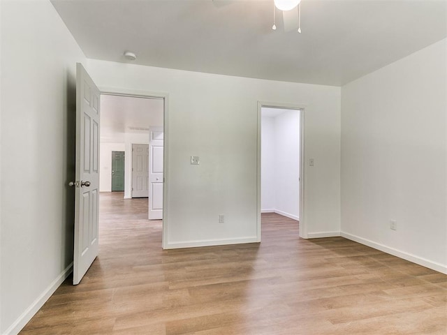 1823 E Rutgers Ave, Guthrie, OK 73044 - spare room featuring baseboards, light wood-style flooring, and ceiling fan