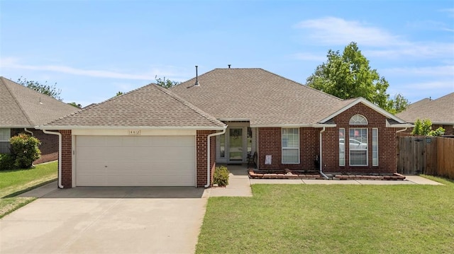 ranch-style house with concrete driveway, a garage, brick siding, and a front yard