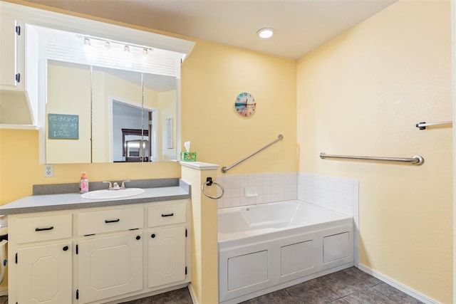 full bath featuring a bath, baseboards, and vanity