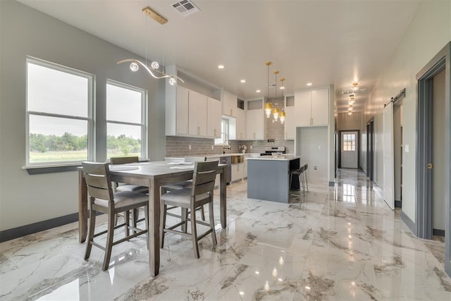dining space with visible vents, recessed lighting, marble finish floor, and baseboards