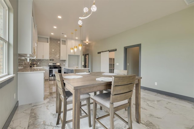 dining room with recessed lighting, a barn door, marble finish floor, baseboards, and visible vents