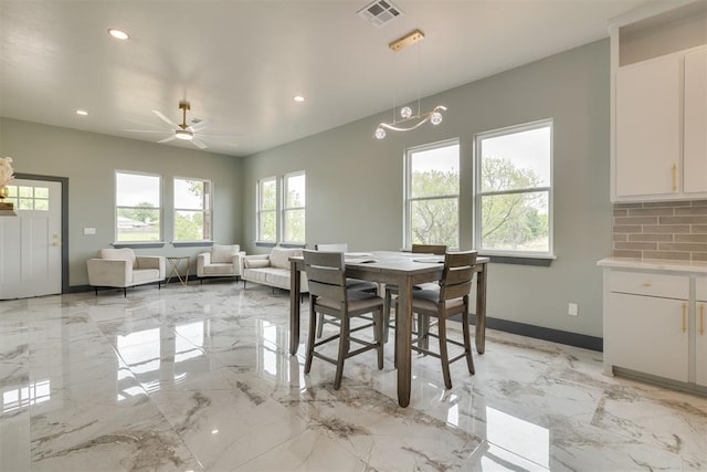 dining area with recessed lighting, marble finish floor, visible vents, and baseboards