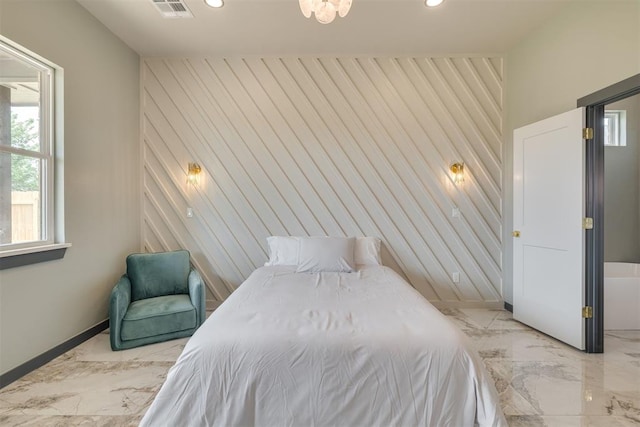 bedroom featuring recessed lighting, an accent wall, marble finish floor, baseboards, and visible vents