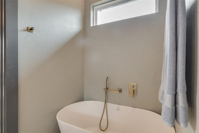 full bathroom featuring a soaking tub