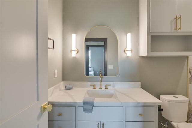 bathroom with vanity and toilet
