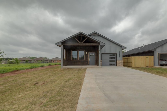 view of front facade with a front lawn, driveway, and an attached garage