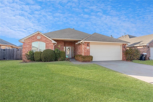2405 Chadsford Ln, Yukon, OK 73099 - view of front facade featuring a garage, concrete driveway, brick siding, and a shingled roof