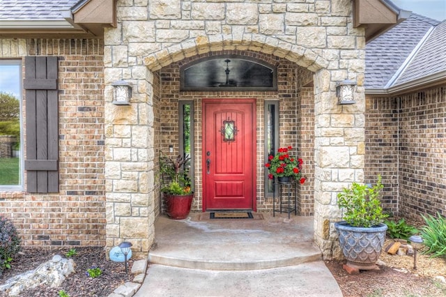 1400 S May Ave, Guthrie, OK 73044 - entrance to property with a shingled roof, stone siding, and brick siding