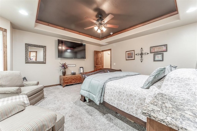 1400 S May Ave, Guthrie, OK 73044 - bedroom featuring a raised ceiling, carpet floors, baseboards, and a ceiling fan
