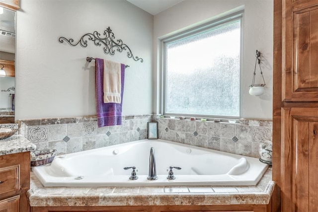 1400 S May Ave, Guthrie, OK 73044 - bathroom featuring healthy amount of natural light, a bath, and vanity