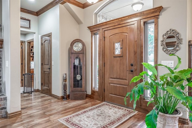1400 S May Ave, Guthrie, OK 73044 - foyer entrance with light wood-type flooring, ornamental molding, plenty of natural light, and baseboards