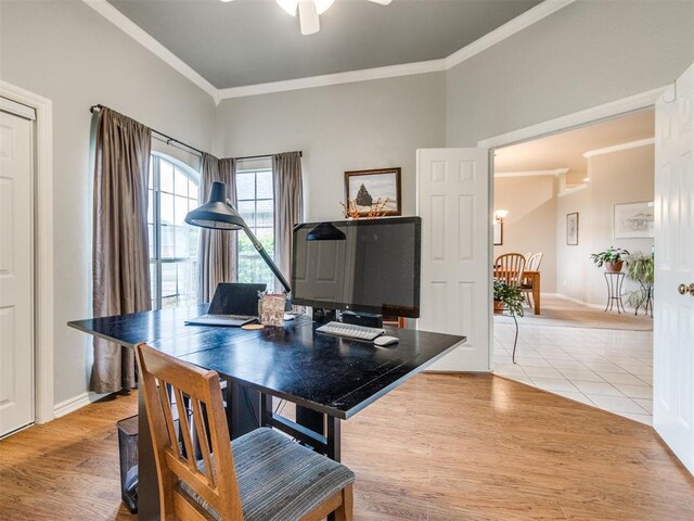 office area featuring crown molding, light tile patterned floors, ceiling fan, and baseboards