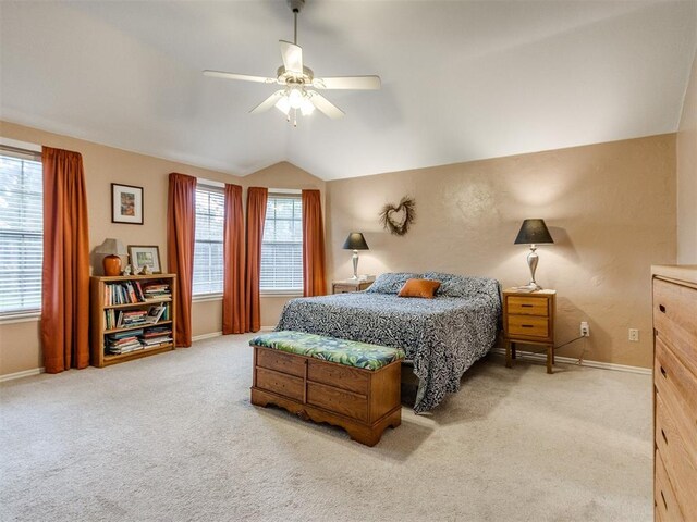 bedroom with carpet flooring, baseboards, and vaulted ceiling