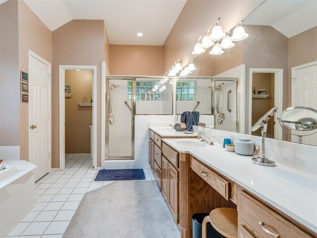 full bath featuring vaulted ceiling, tile patterned floors, vanity, and a stall shower