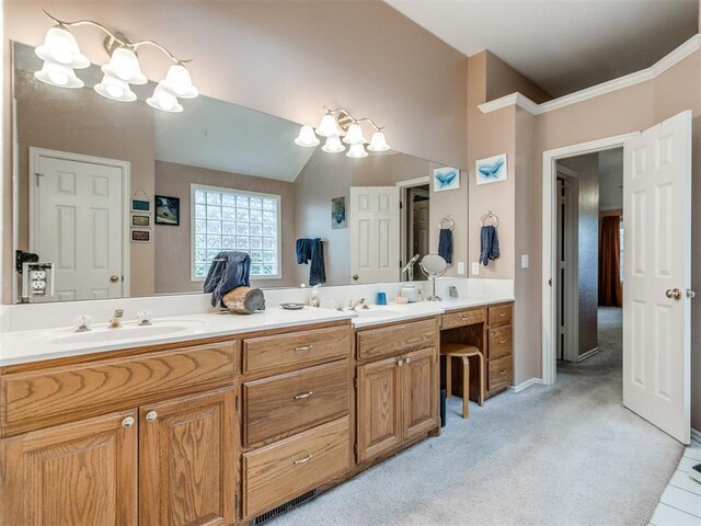 bathroom featuring a sink, an inviting chandelier, and double vanity