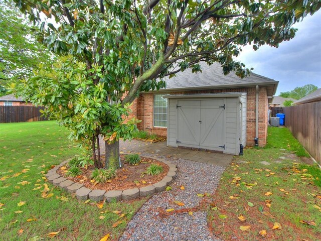 view of outdoor structure featuring a fenced backyard