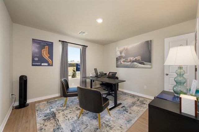 home office with recessed lighting, wood finished floors, visible vents, and baseboards