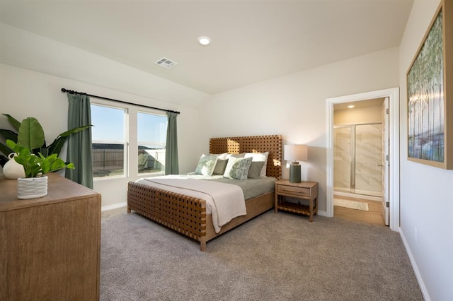 carpeted bedroom with visible vents, ensuite bathroom, recessed lighting, and baseboards