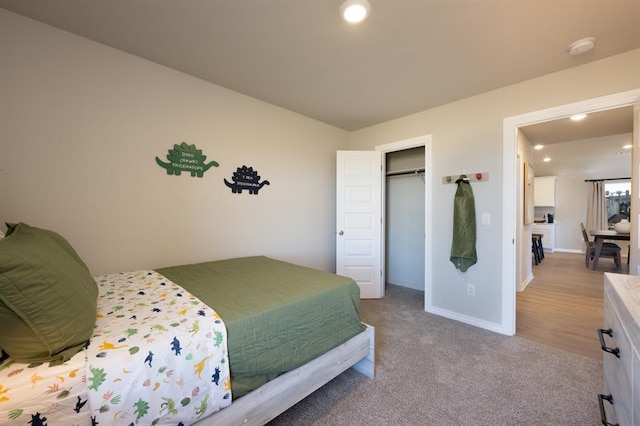 carpeted bedroom featuring recessed lighting, a closet, and baseboards