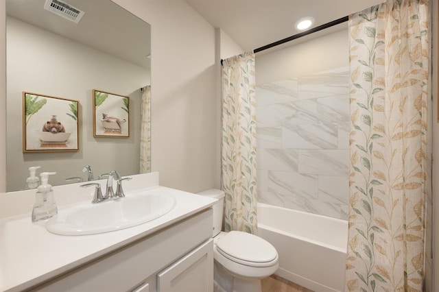 bathroom featuring toilet, visible vents, shower / bathtub combination with curtain, and vanity