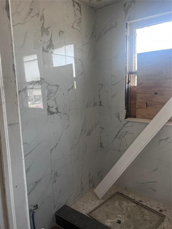 bathroom featuring a shower